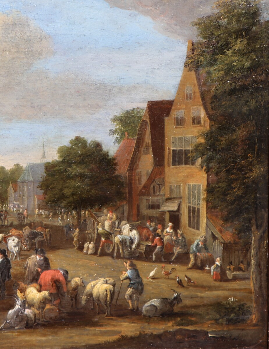 A cattle market, a theatre company performing in the background
