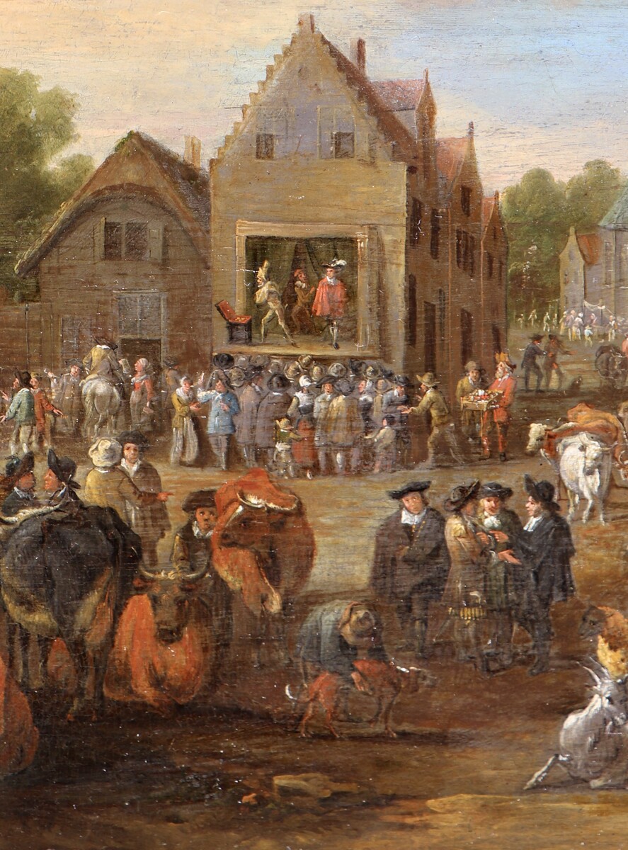 A cattle market, a theatre company performing in the background