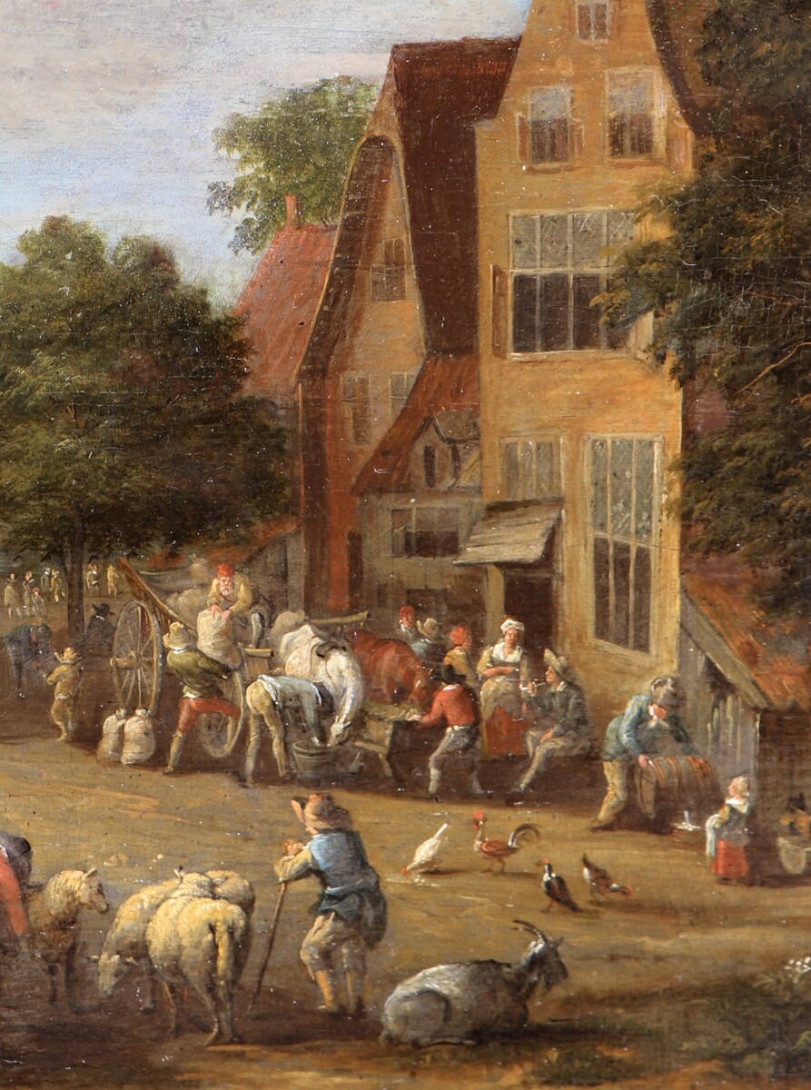 A cattle market, a theatre company performing in the background