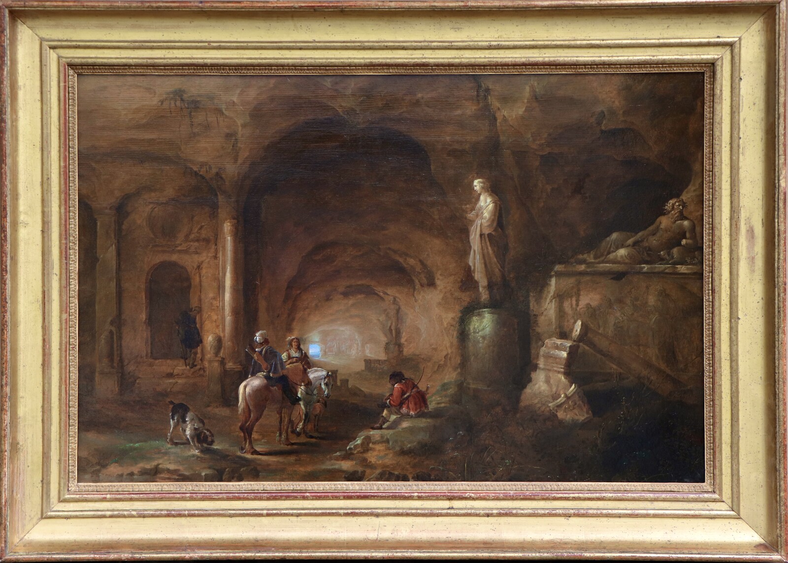 Hunters resting in a mysterious cavern surrounded by Roman monuments