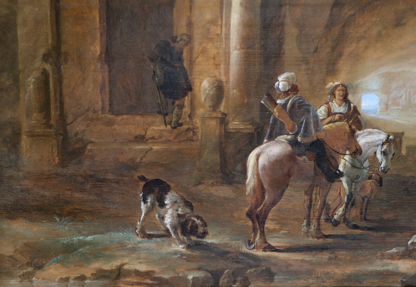 Hunters resting in a mysterious cavern surrounded by Roman monuments