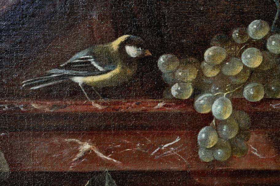 A swag of fruit against an architectural background