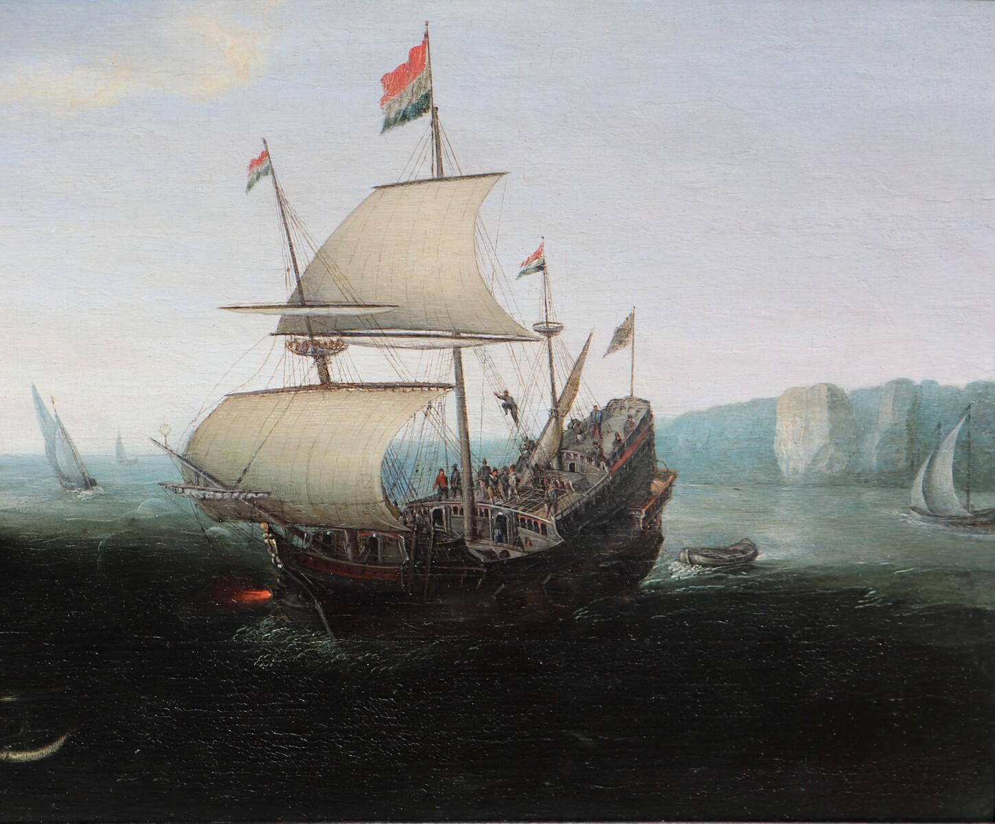 A Dutch ship firing a salute at a garrison