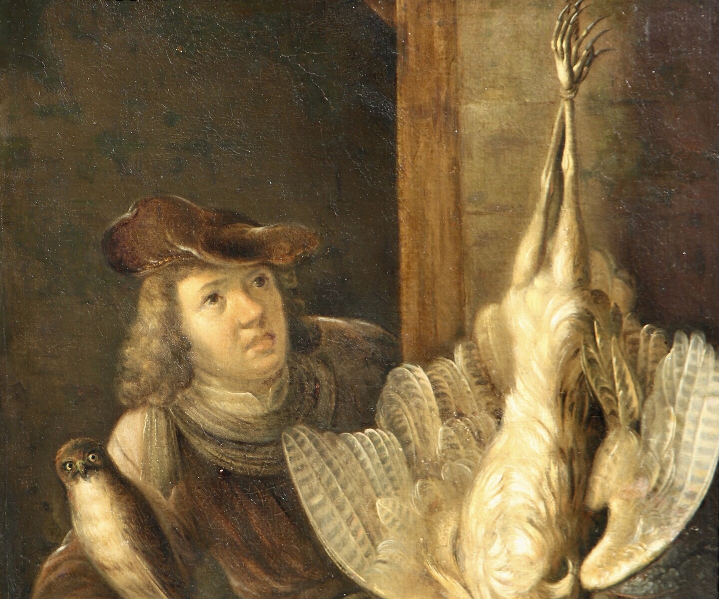 A falconer posing with his catch