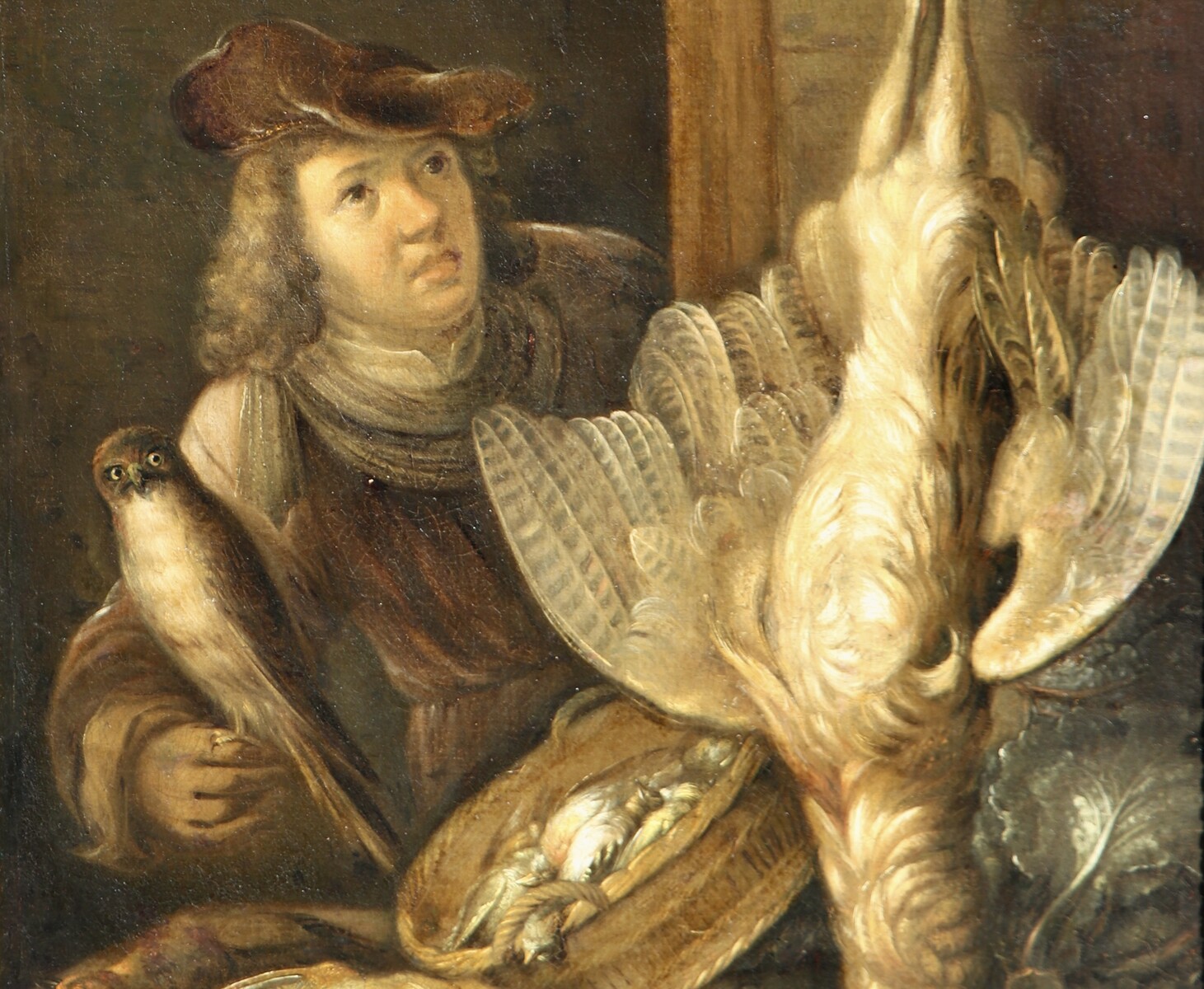 A falconer posing with his catch