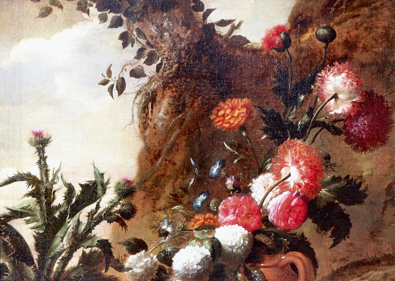 A forest floor with a thistle, a flowered jug and two frogs