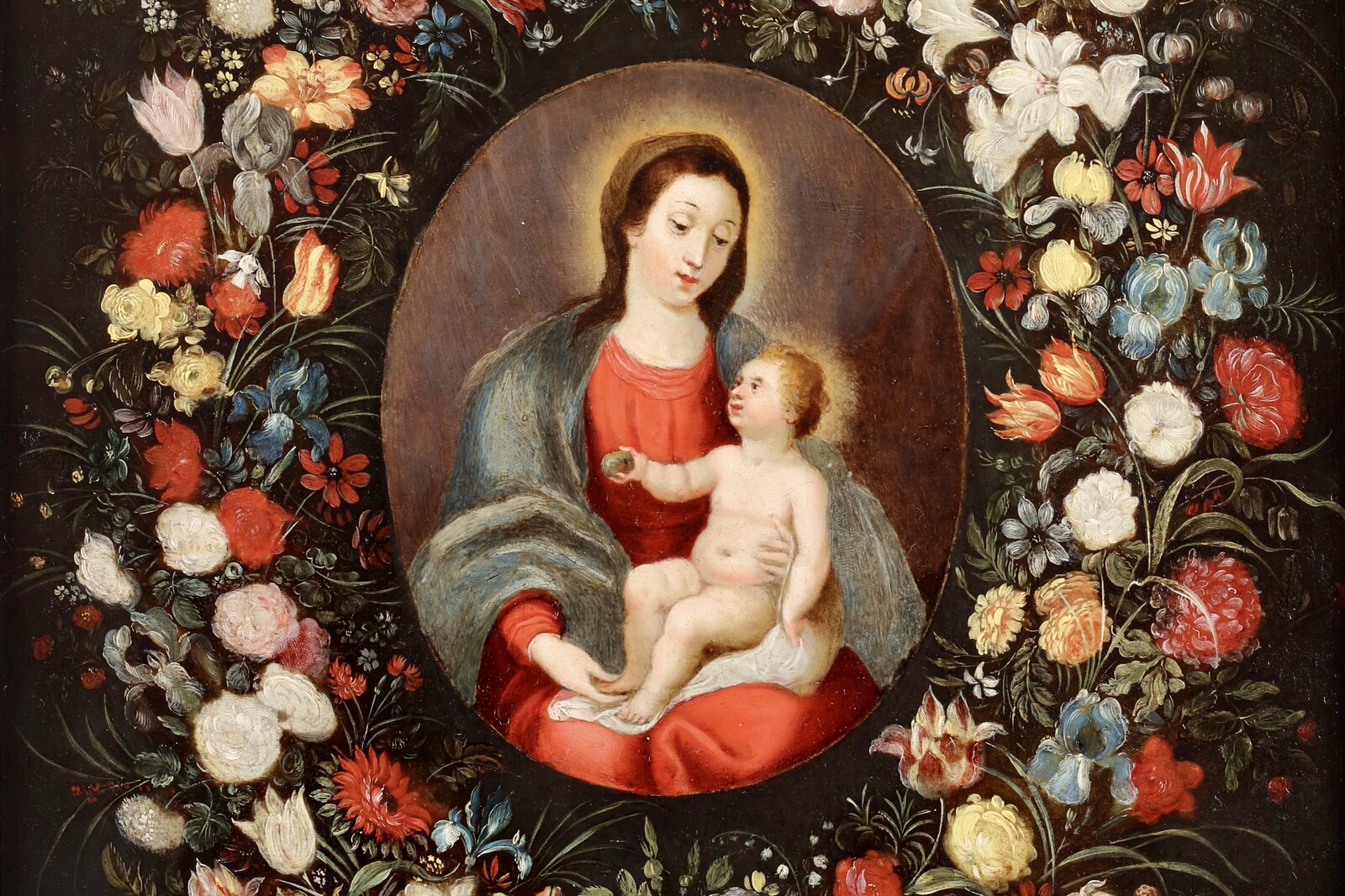 A garland of flowers surrounding the Virgin and Child