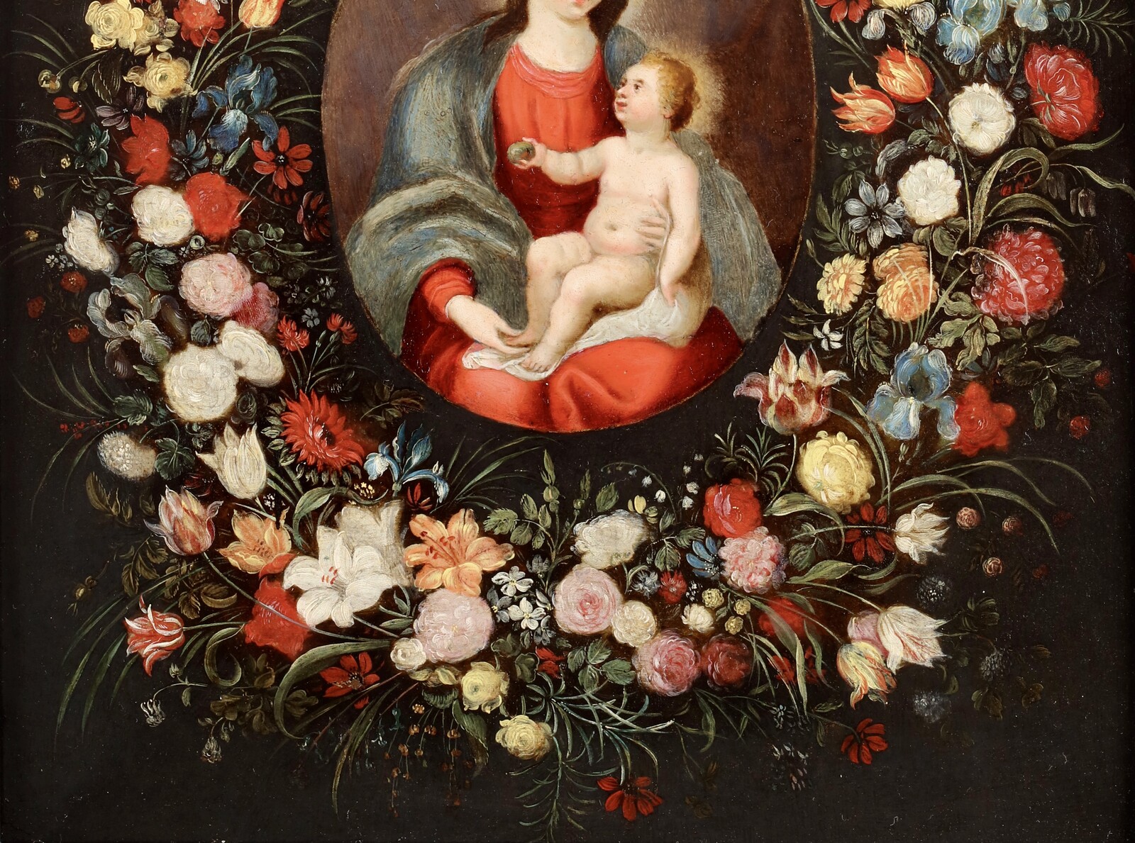 A garland of flowers surrounding the Virgin and Child