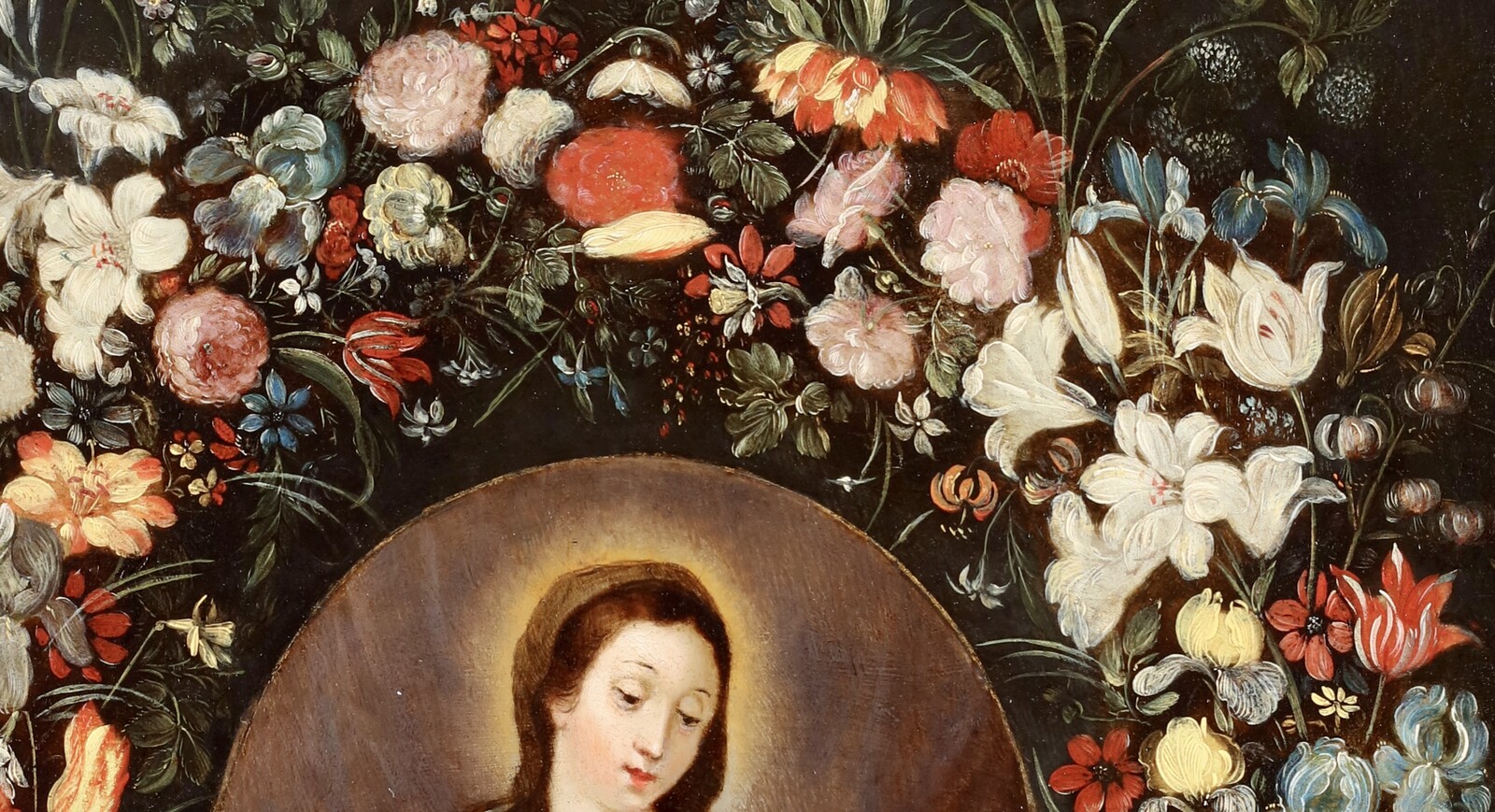 A garland of flowers surrounding the Virgin and Child