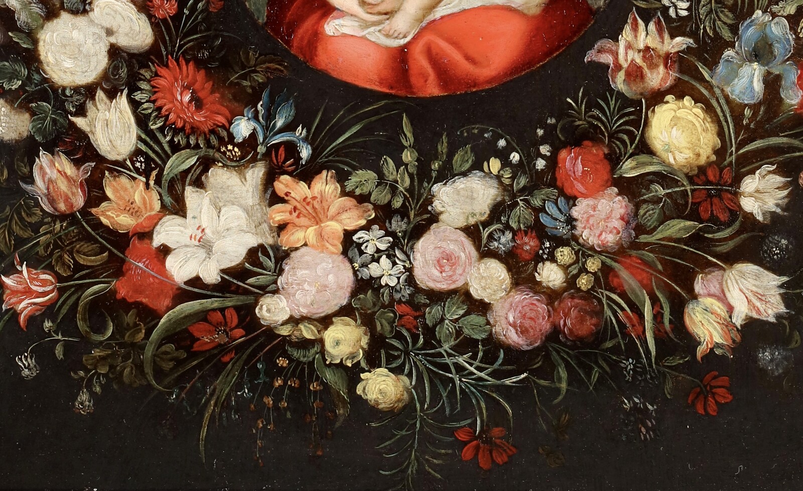 A garland of flowers surrounding the Virgin and Child