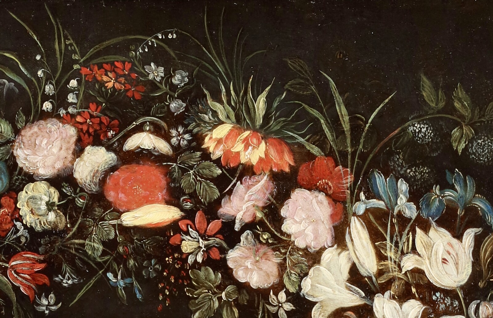 A garland of flowers surrounding the Virgin and Child