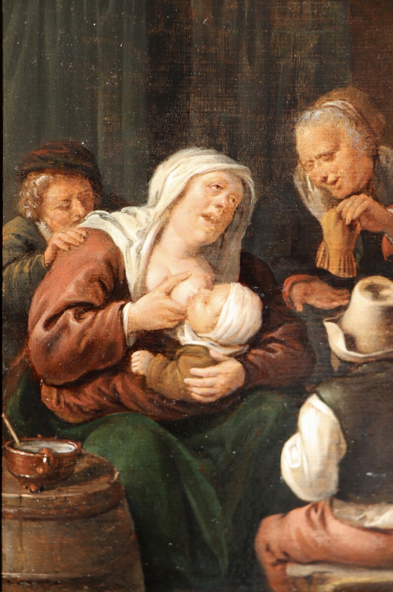 A mother breastfeeding a baby
