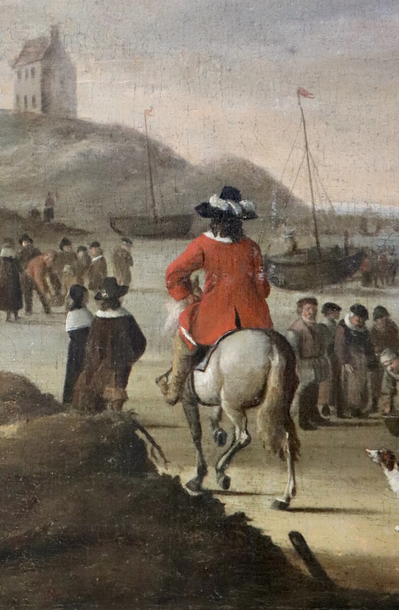 An elegant couple buying fish on the beach