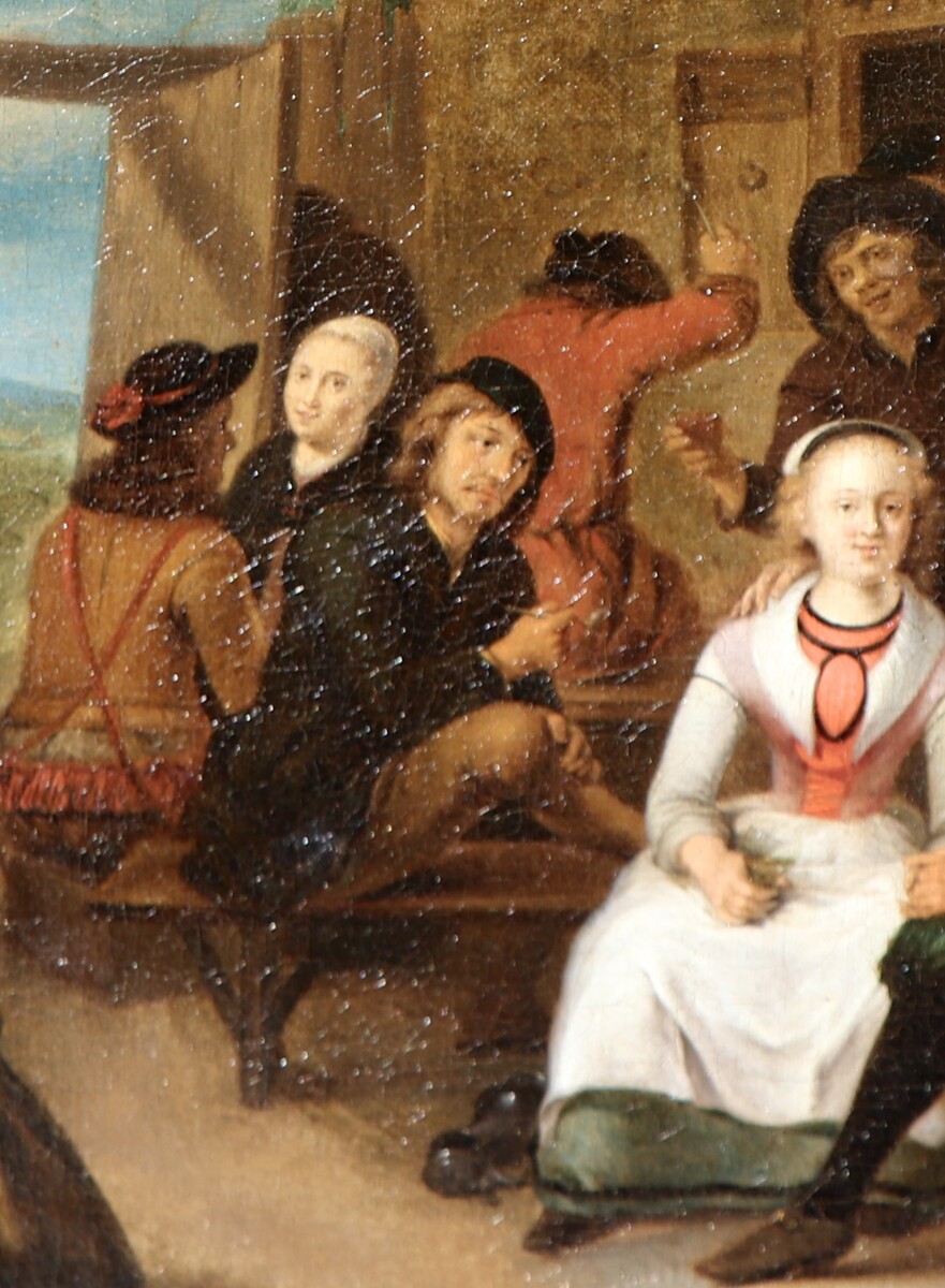 An elegant couple outside a tavern