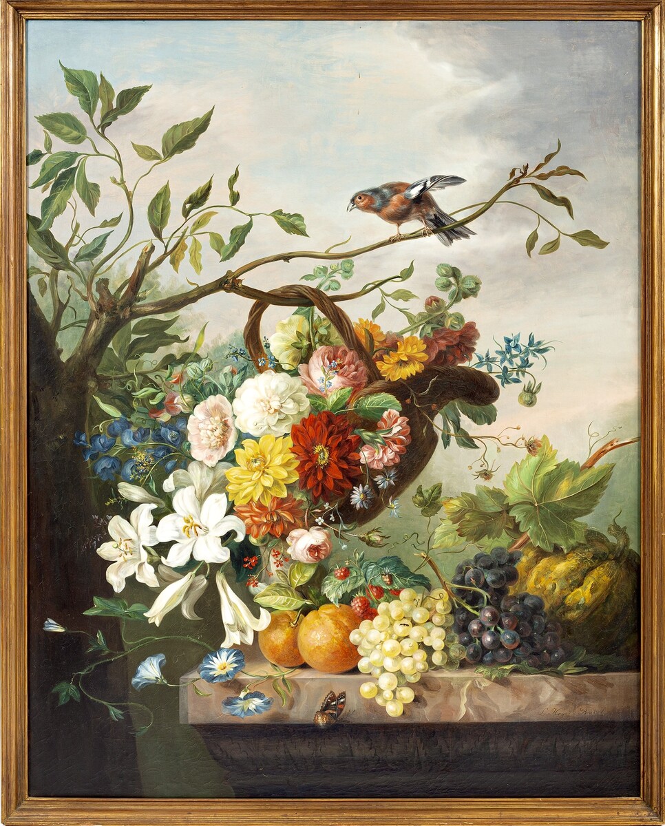 Flowers in a basket and fruit on a stone ledge