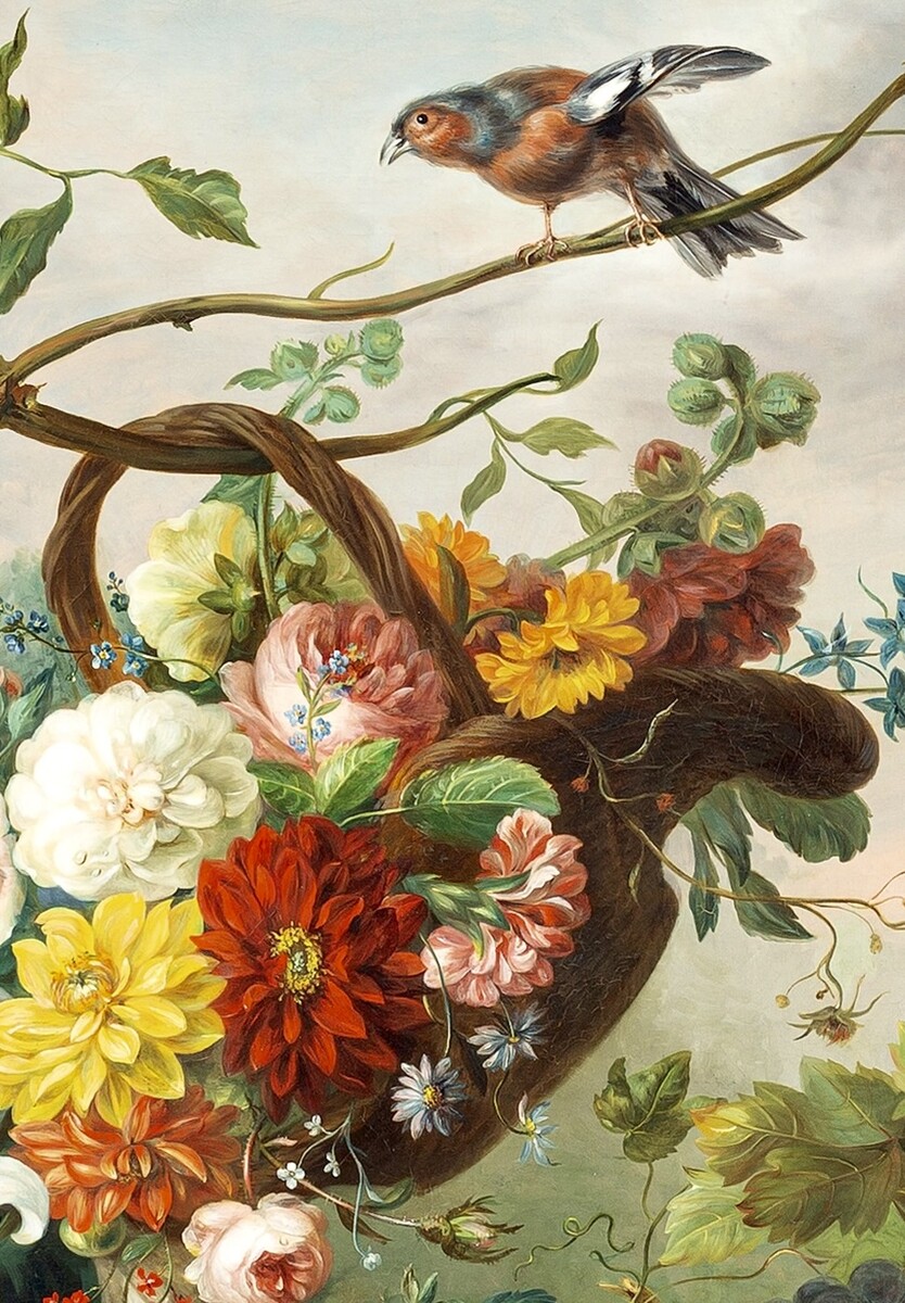 Flowers in a basket and fruit on a stone ledge