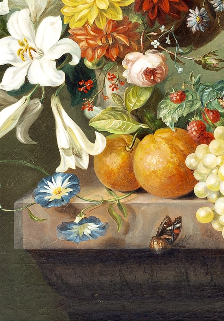 Flowers in a basket and fruit on a stone ledge