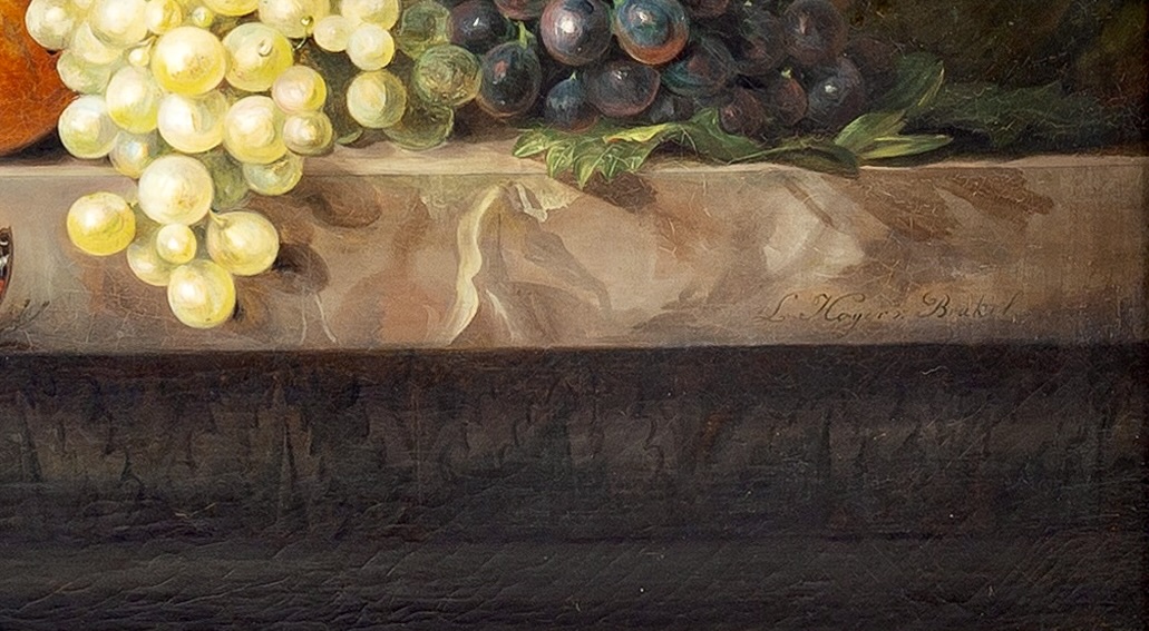 Flowers in a basket and fruit on a stone ledge