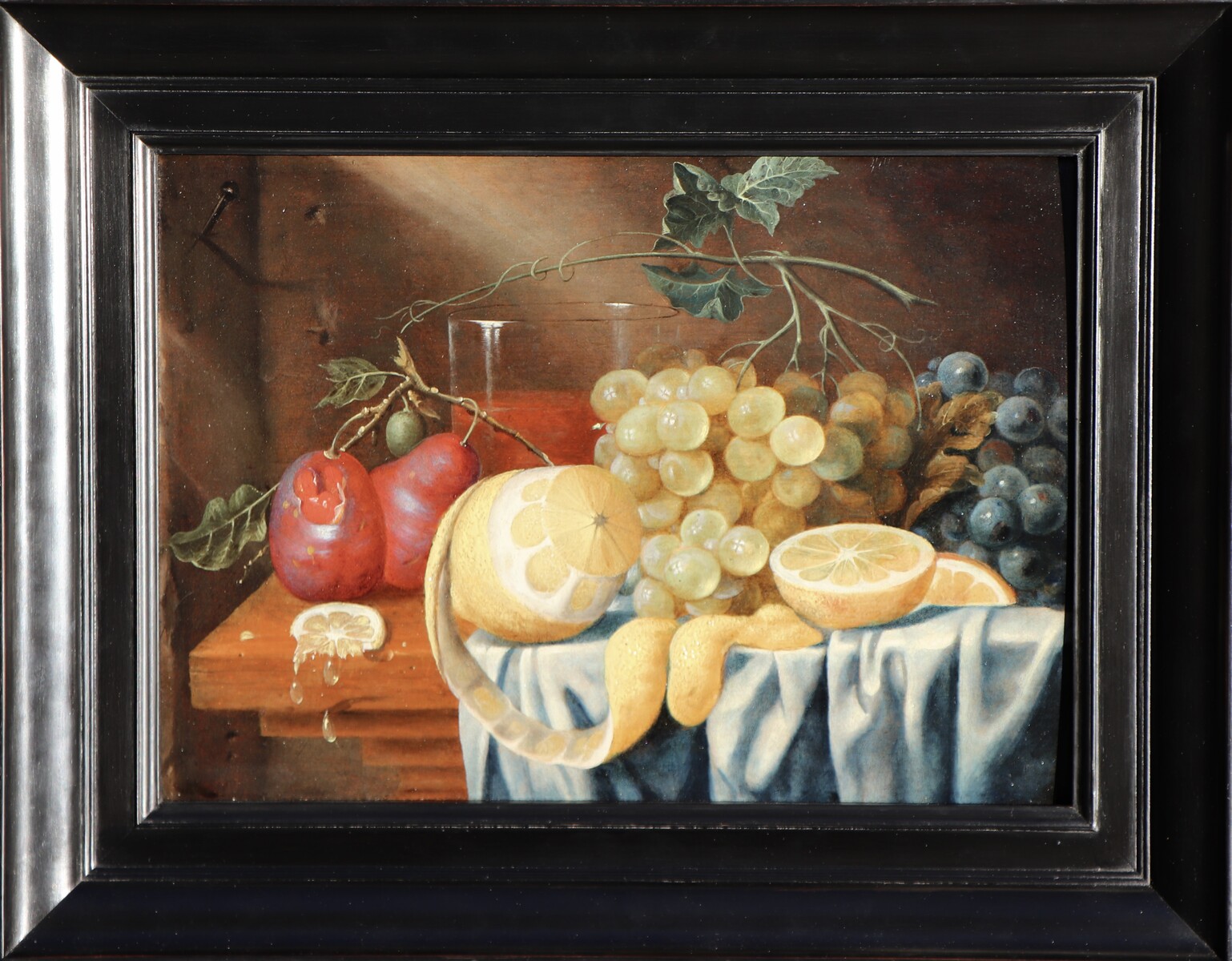 Fruit still life on a partly draped table