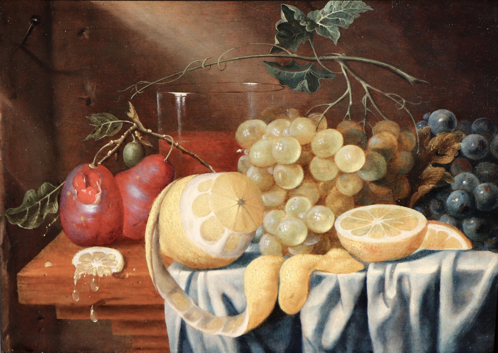 Fruit still life on a partly draped table