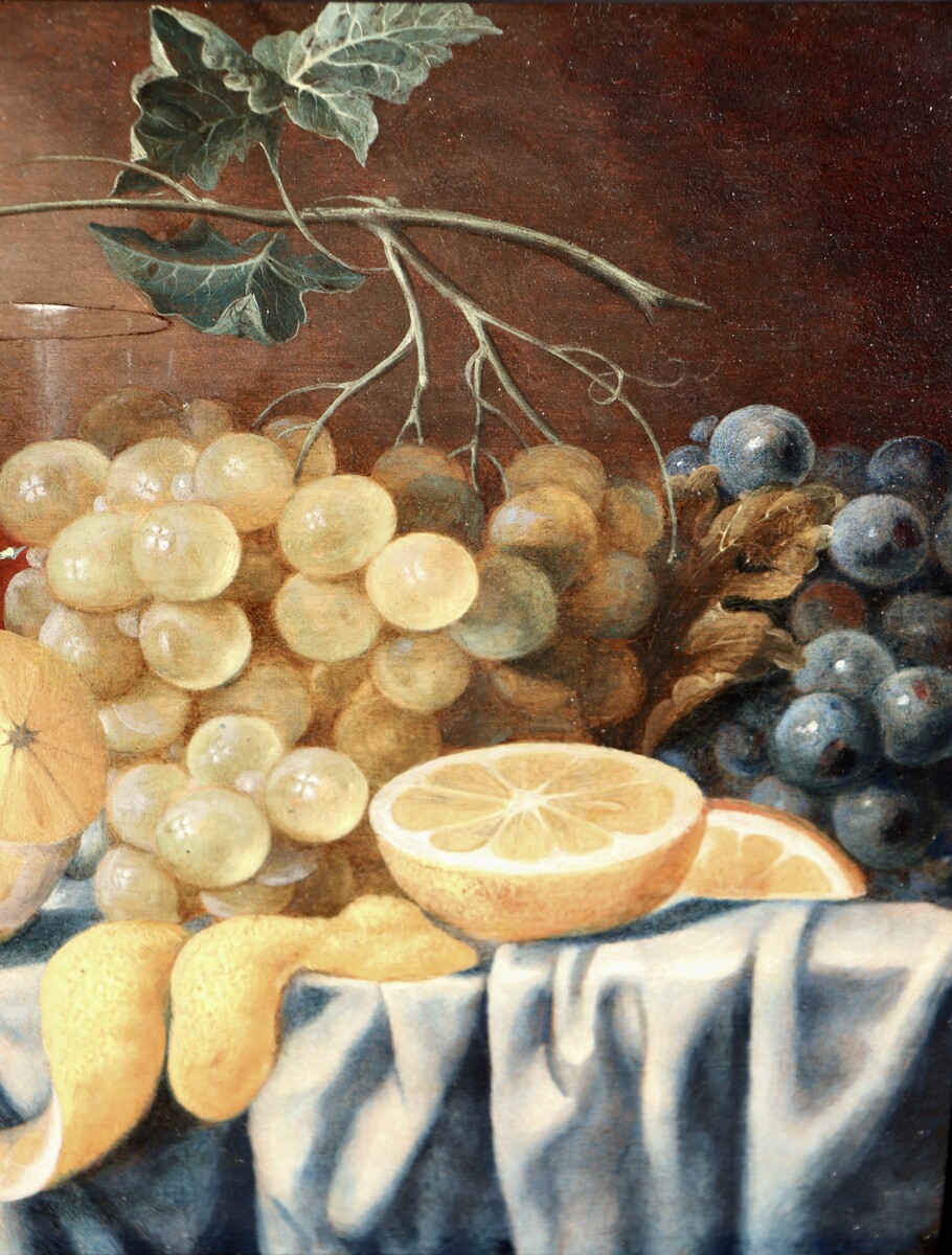 Fruit still life on a partly draped table