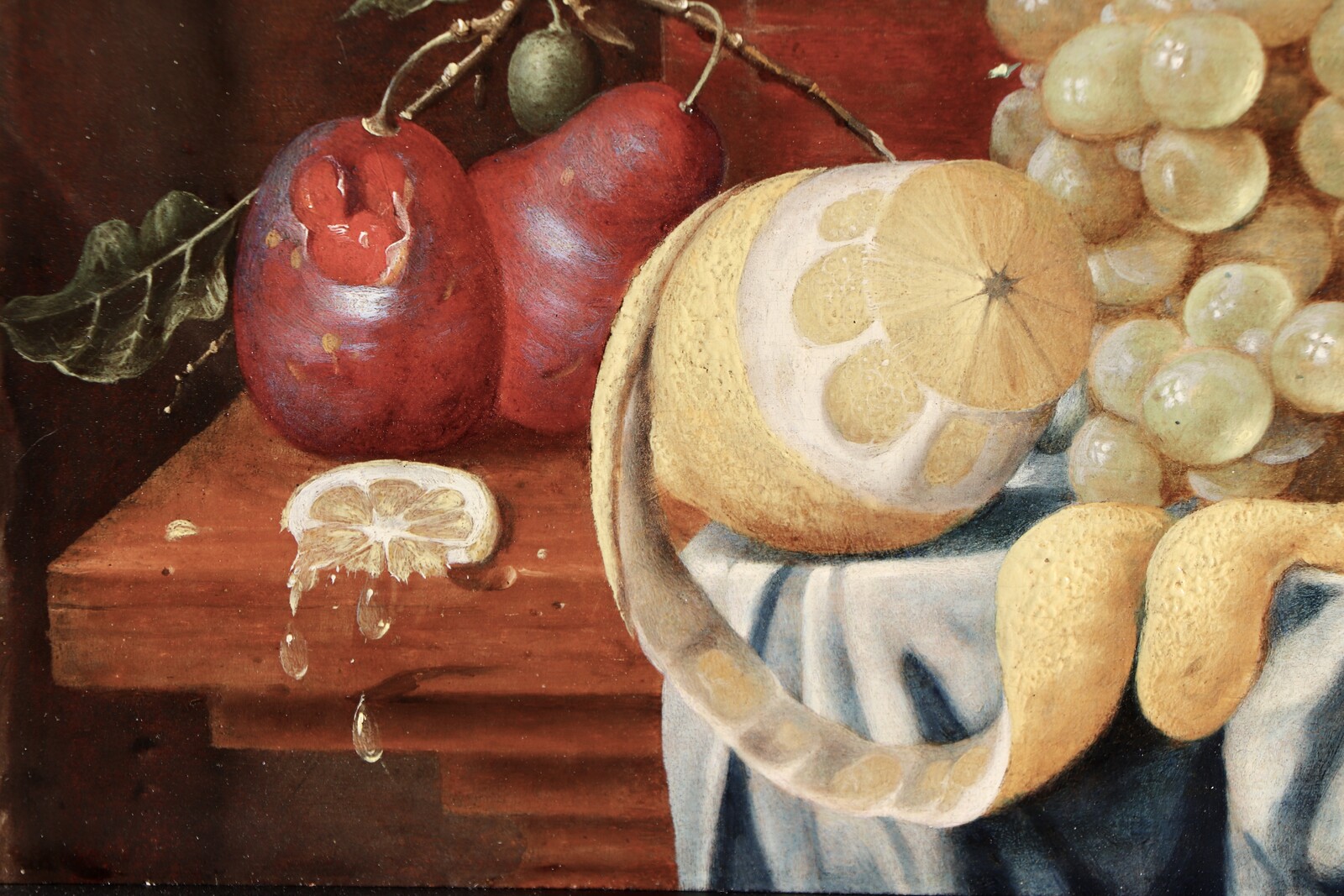 Fruit still life on a partly draped table