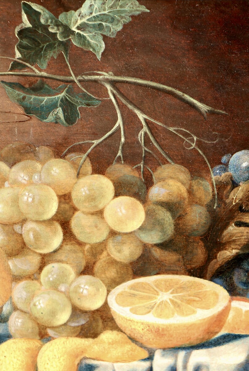 Fruit still life on a partly draped table