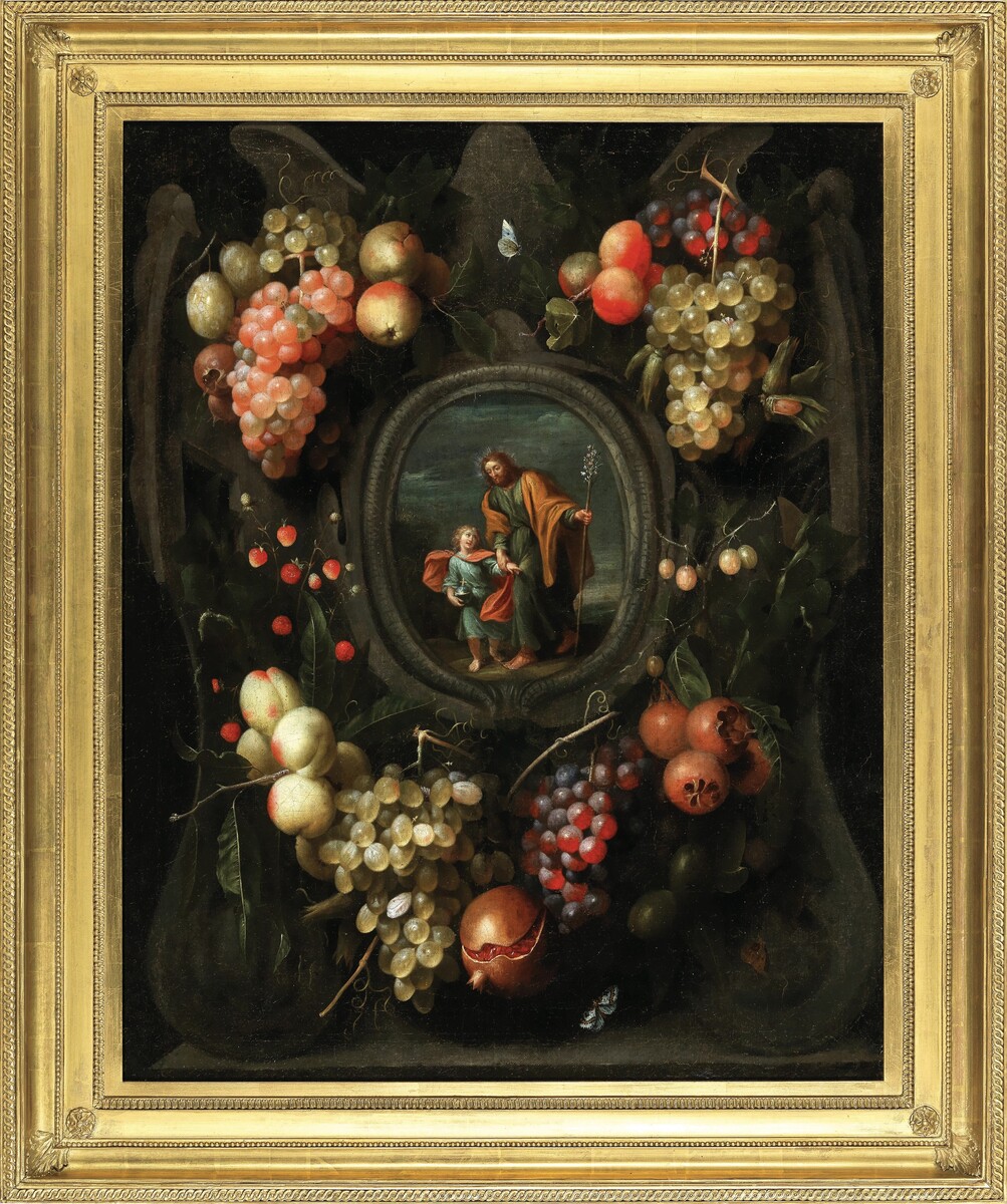 Garlands of fruit adorning a stone cartouche with Joseph and the Christ Child