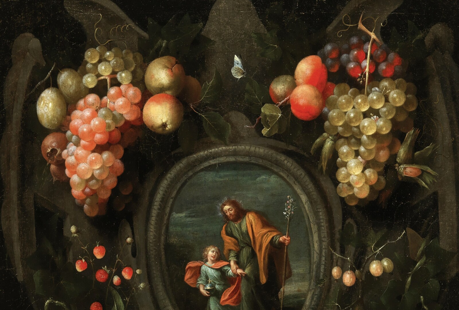 Garlands of fruit adorning a stone cartouche with Joseph and the Christ Child