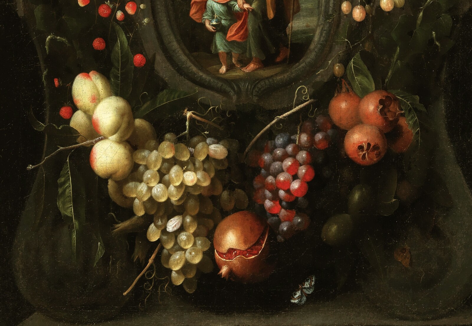 Garlands of fruit adorning a stone cartouche with Joseph and the Christ Child