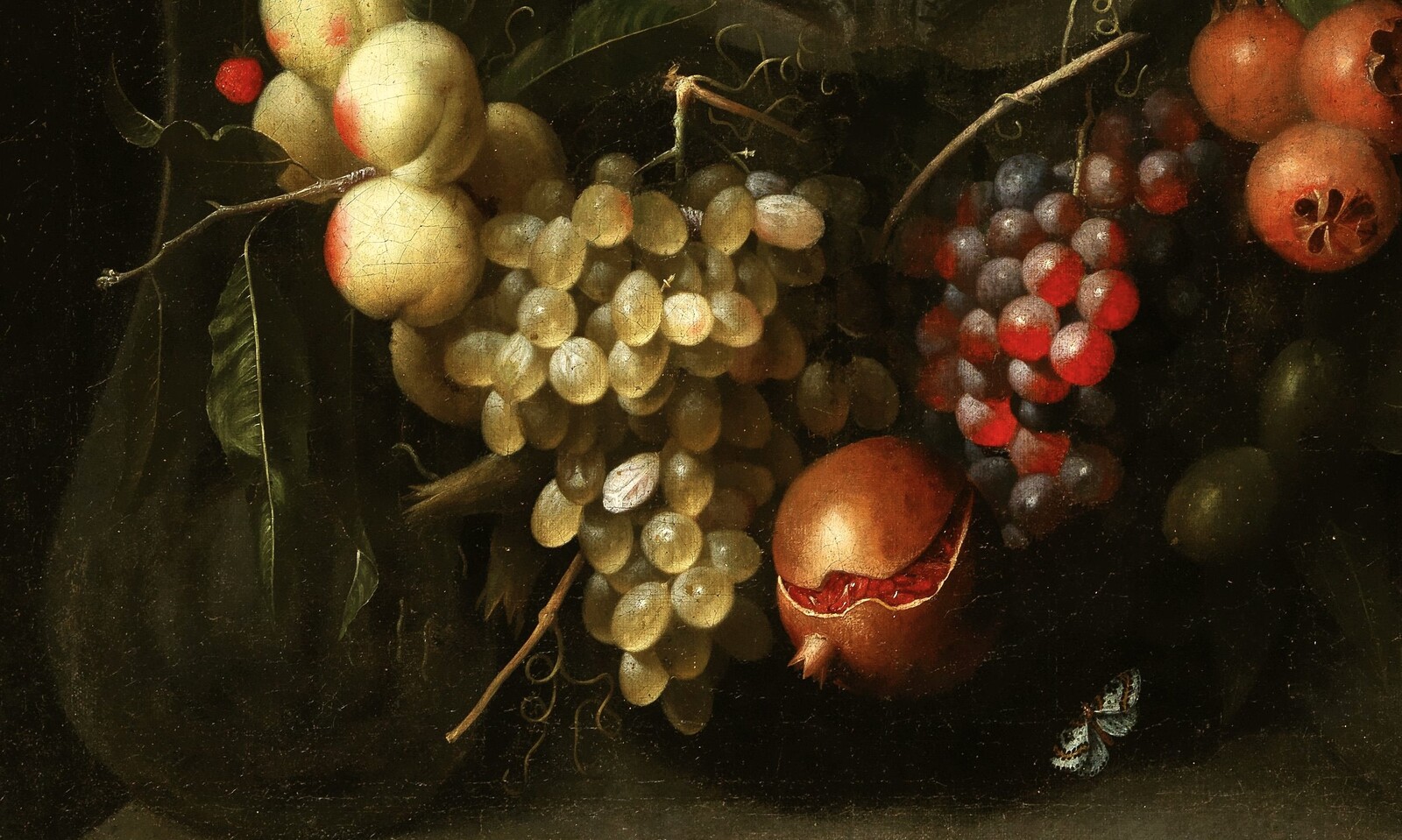 Garlands of fruit adorning a stone cartouche with Joseph and the Christ Child