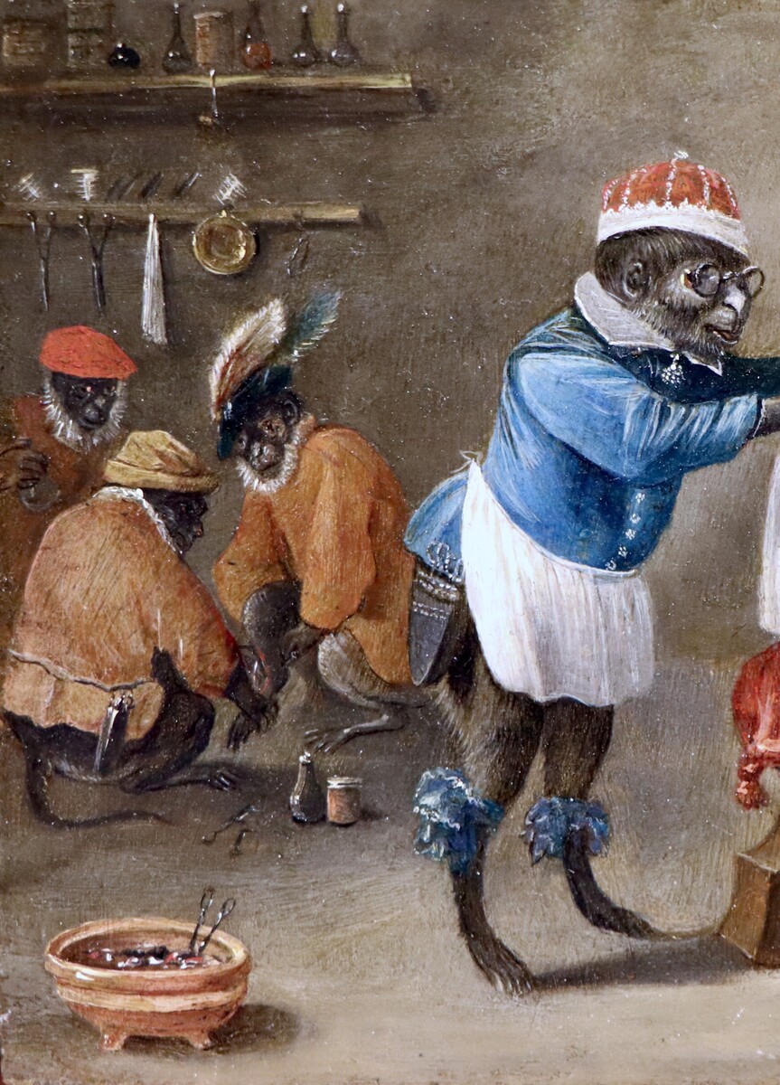 Monkey-trick with a cat at the monkey-barber