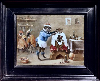 Monkey-trick with a cat at the monkey-barber
