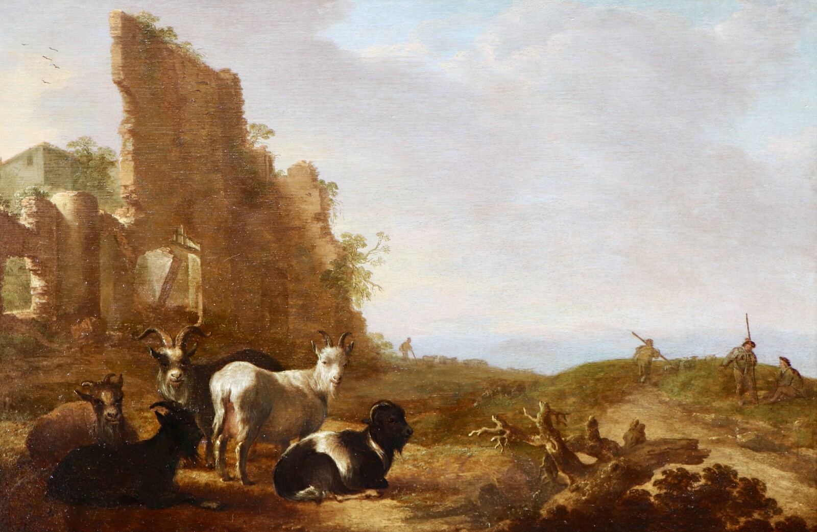 Shepherds with their goats in an Italianate landscape