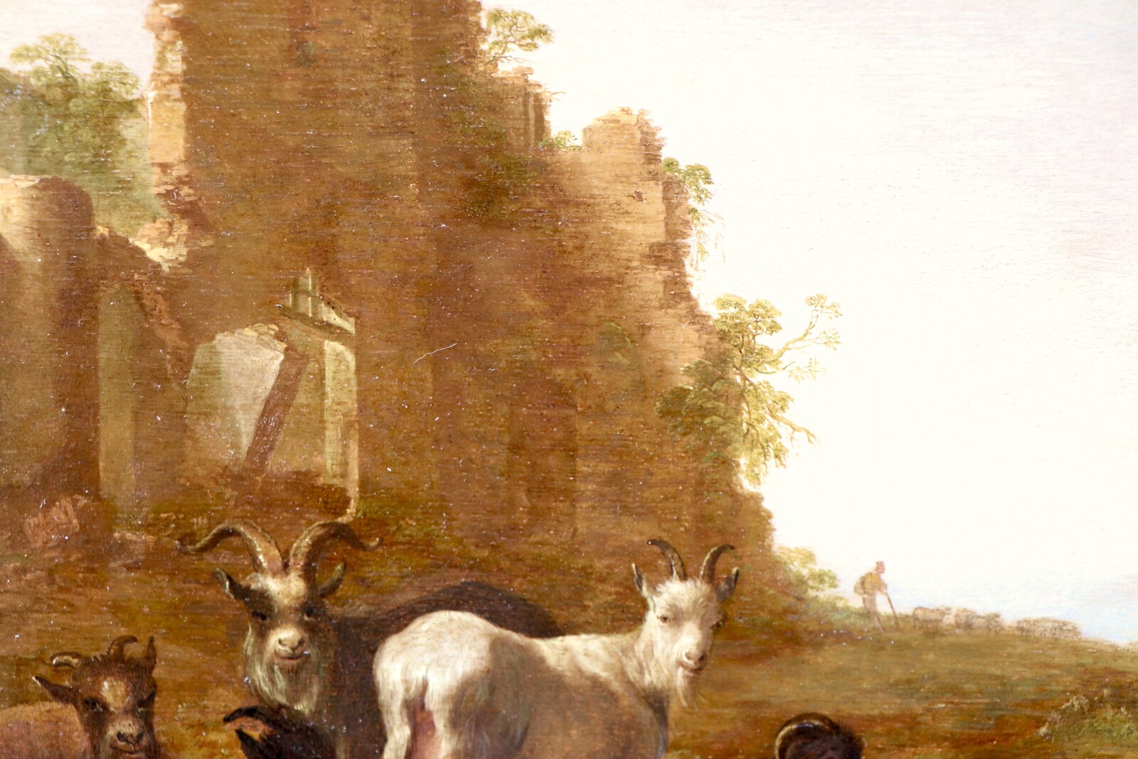 Shepherds with their goats in an Italianate landscape